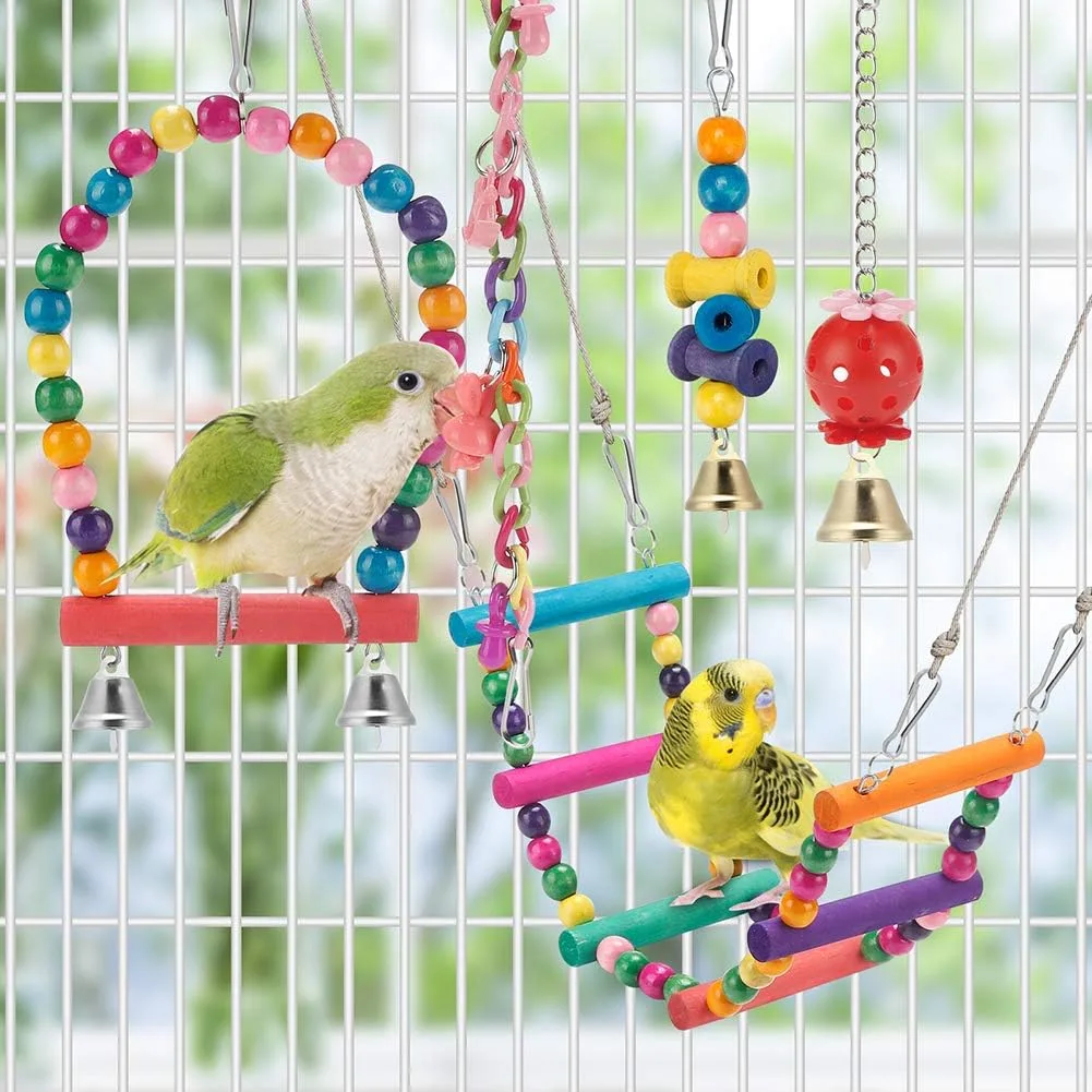 parakeet toys set hanging in a bird cage