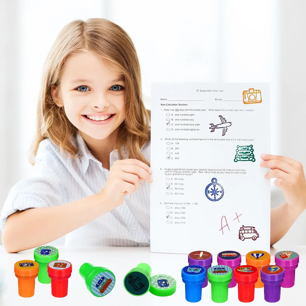 girl stamping a card with self-inking stampers