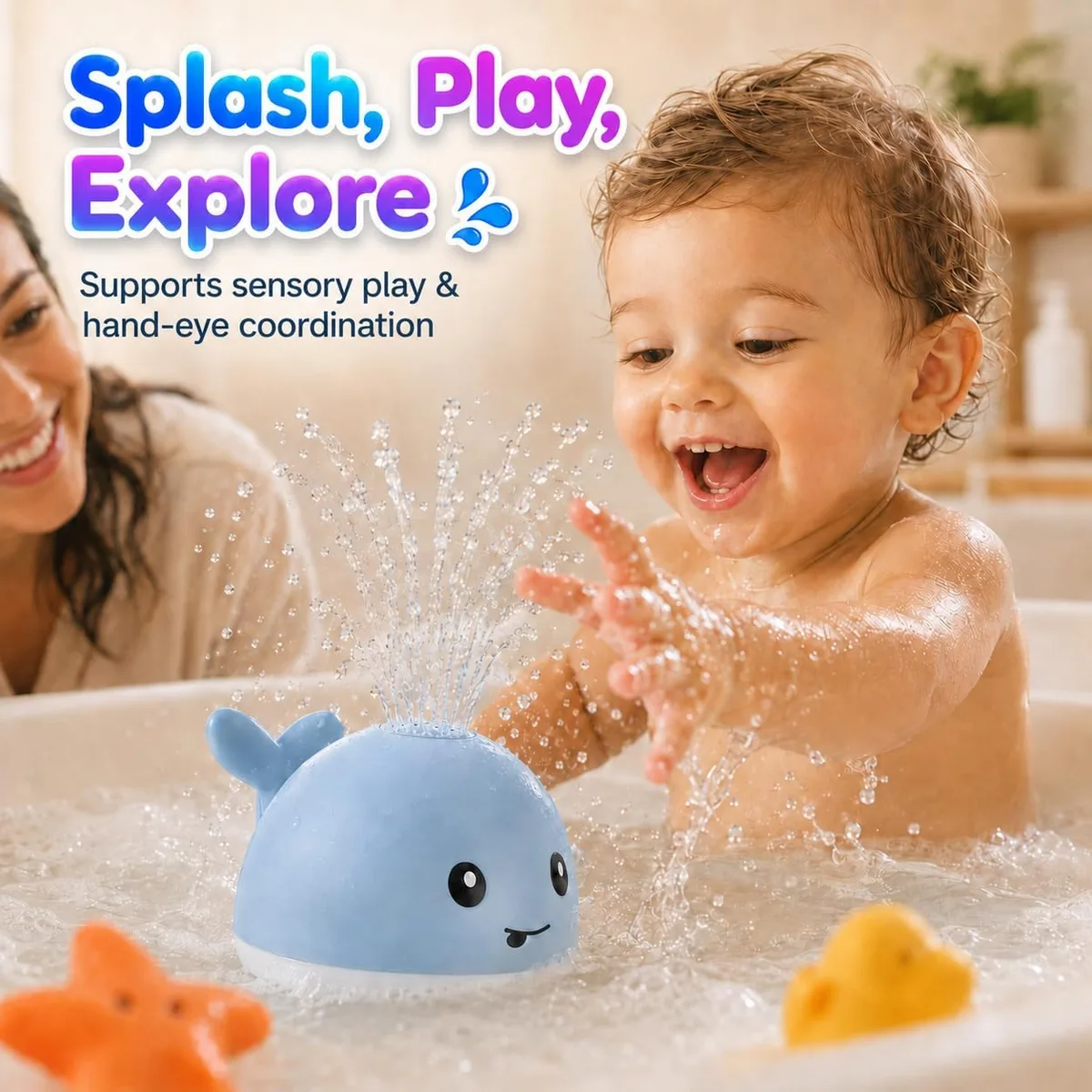 toddler splashing with the light-up whale bath toy