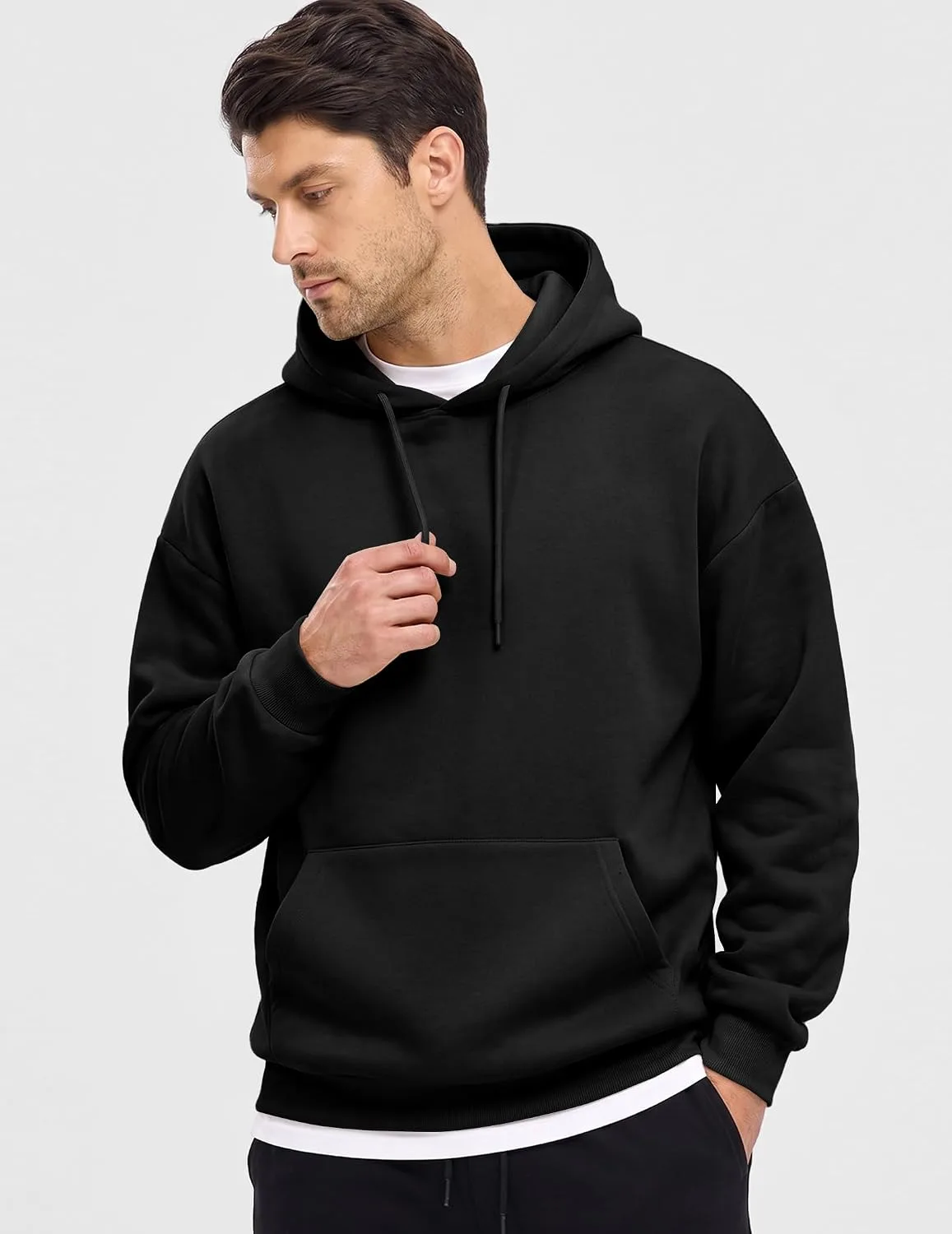 man wearing a black fleece lined hoodie