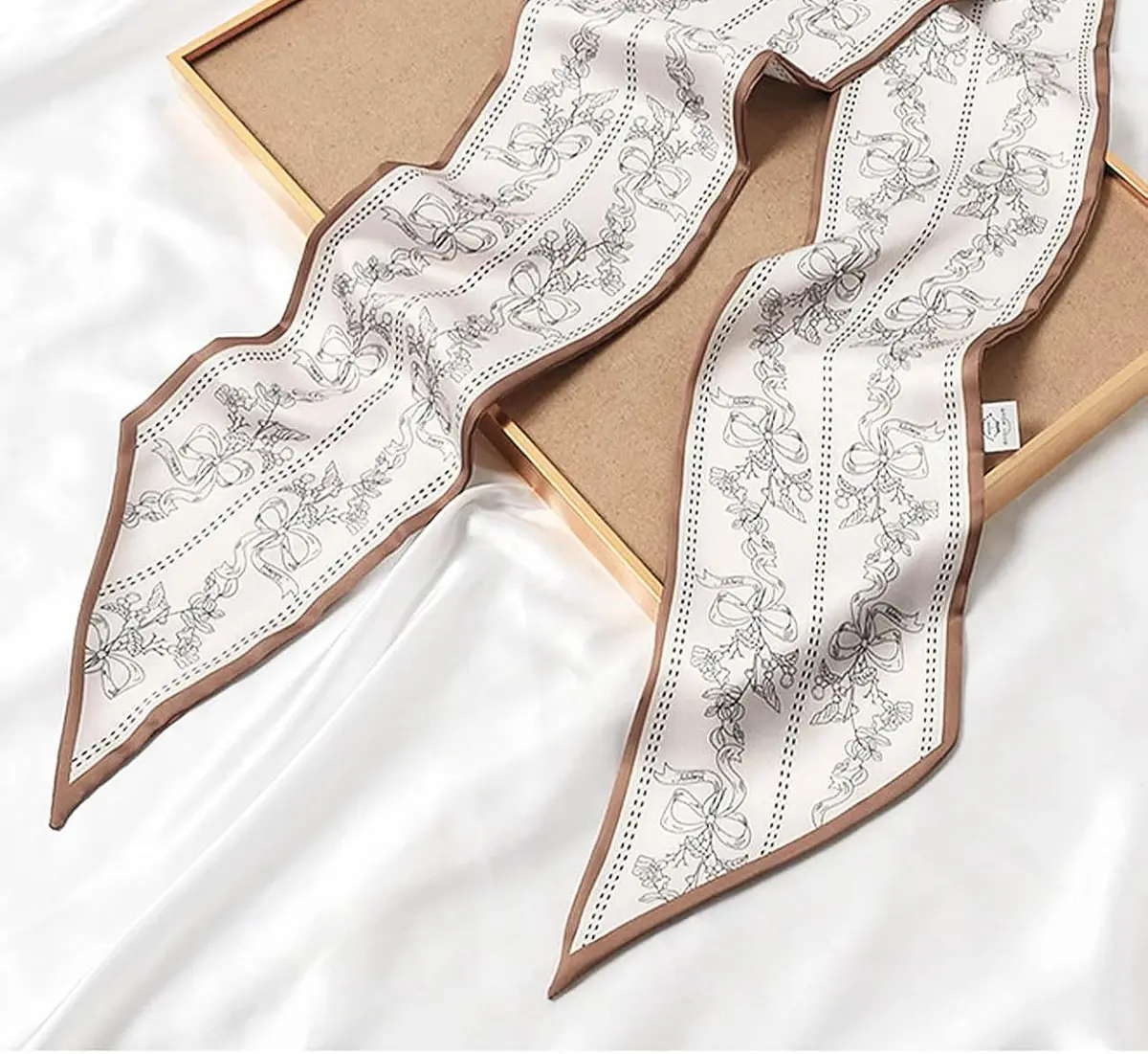 skinny silk feel scarf on a gift box