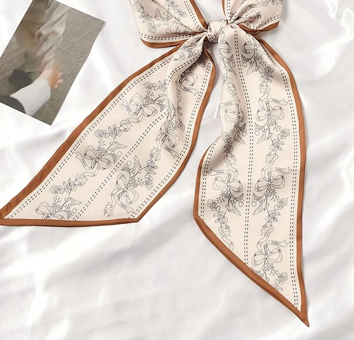 skinny satin scarf tied in a bow